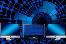 three computers in a row against a blue background